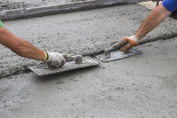 Before and after of concrete repair work in Agoura Hills showing crack repair and resurfacing