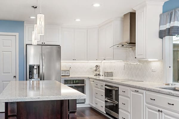 Agoura Hills kitchen contractors installing custom cabinetry and quartz countertops