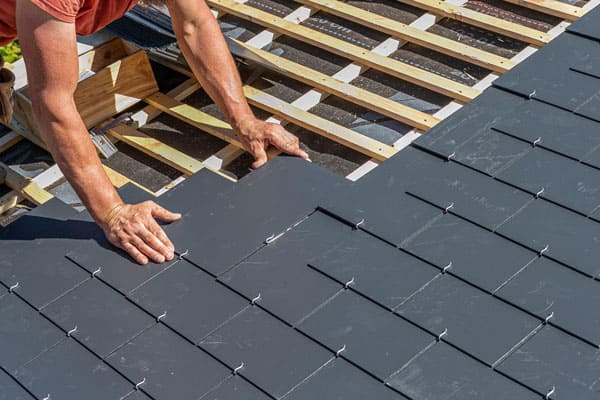 Before and after of a roof replacement project in Agoura Hills showing complete transformation
