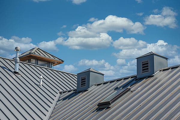 Agoura Hills roofing contractors installing new tile roof with proper underlayment